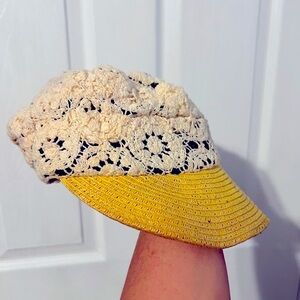 Vintage 1970s ladies crocheted cap hat with yellow straw visor.